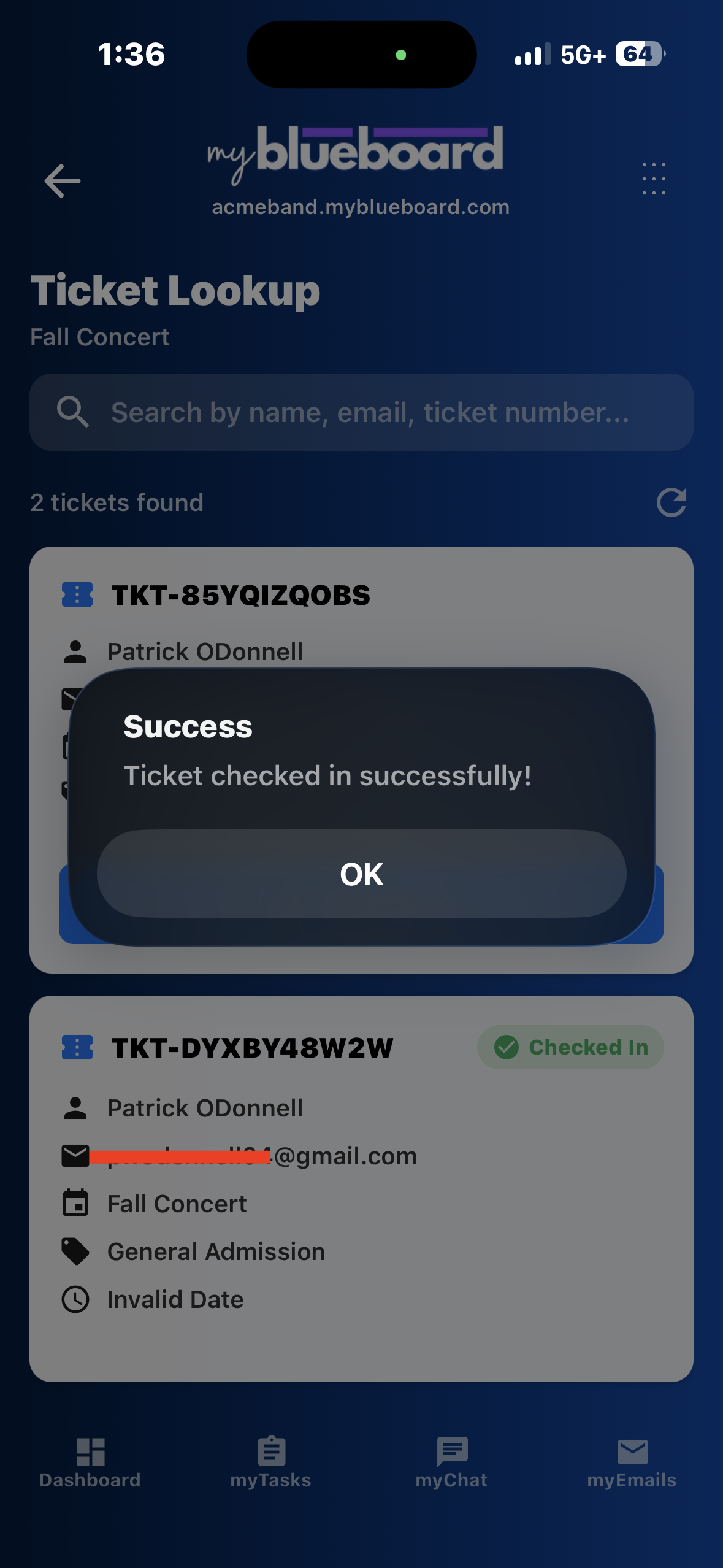 A Success dialog reading "Ticket checked in successfully!" over the ticket lookup list